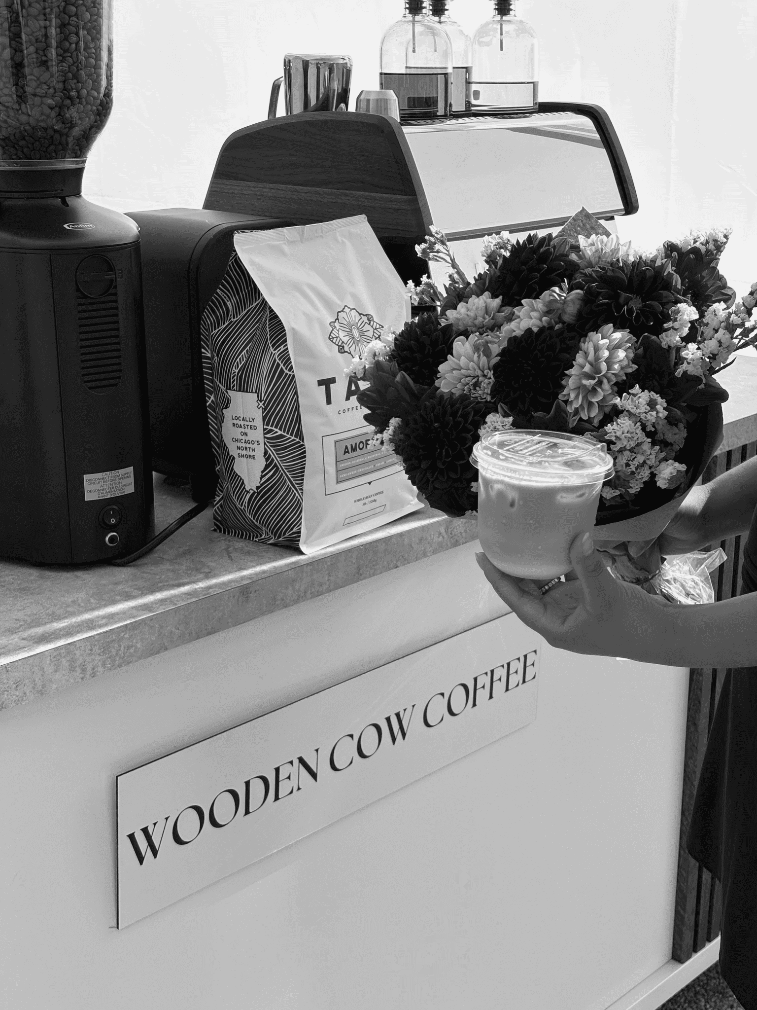 Cart setup with fresh flowers and a specialty drink