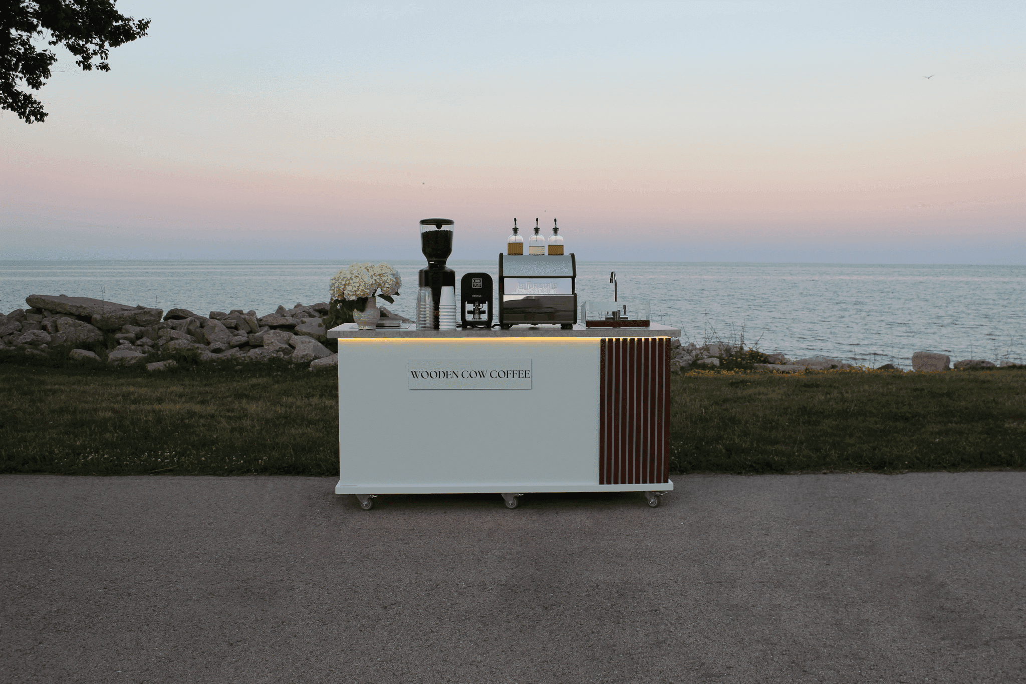 Wooden Cow Coffee cart at the lakefront at dusk
